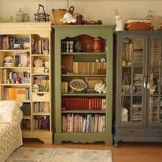 a living room filled with lots of furniture and bookshelves next to each other