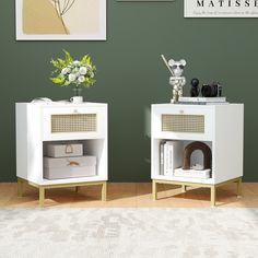 two white side tables sitting next to each other on top of a hard wood floor