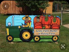 a large sign that says lewis's farm market and petting farm on it