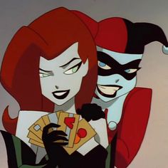 an animated image of two people dressed as batman and catwoman, one holding playing cards