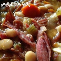 a bowl filled with soup and beans on top of a table