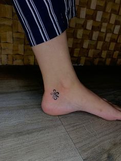 a person with a clover tattoo on their foot