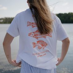 Our AT THE LAKE | Freshwater Fish Unisex Tee was inspired by summer spent at the lake – fishing with dad, jumping in the lake with cousins and just soaking up sweet summertime with our favorite people. This Comfort Colors Unisex Tee has that lived in feel with a relaxed fit, and almost no shrinkage at home. Fits true to size - suggestion to size up. Great tee for Father's Day & all summer long. DETAILS:• Comfort Colors Adult Unisex Heavyweight RS T-Shirt• Artwork was designed in-house and screen At Home Fits, Home Fits, Sweet Summertime, Lake Fishing, At The Lake, Freshwater Fish, Pet Tags, Shopping Trip, Guinea Bissau