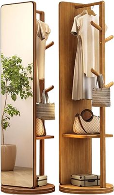 a wooden shelf with clothes and purses on it in front of a large mirror