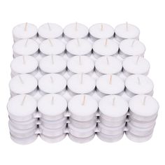 many white candles stacked on top of each other