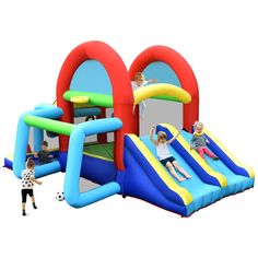 an inflatable bounce house with two children playing on it