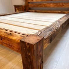 a bed frame made out of wooden planks