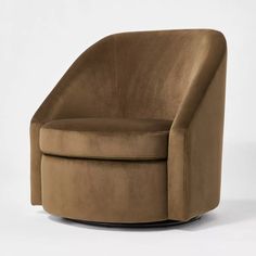 a brown swivel chair sitting on top of a white floor