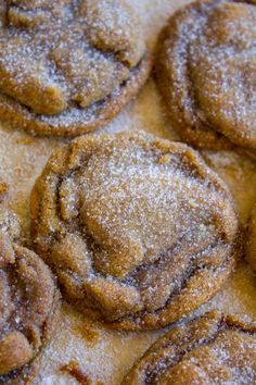 several cookies are covered in powdered sugar