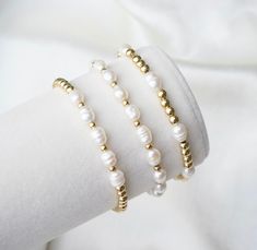 💫  14k gold filled beaded bracelet stack. Made with mini freshwater pearls. You will receive 3 bracelets with the same pattern above. 💫  Minimalist style with a beautiful elegant pearl and gold color palette. 💫 These elegant bracelets are perfect for weddings, bridesmaid gifts and for engagement gifts. Delicate stacking bracelets to elevate any outfit. 💫  4mm gold filled beads with 5mm mini freshwater pearls.  Strung on a premium stretch cord, my classic elegant 14k gold filled bead bracelet Gold Color Palettes, Freshwater Pearl Bracelet, Elegant Bracelet, Christmas Gifts For Her, Wedding Bracelet, Bracelet Stack, Engagement Gifts, Pearl Bracelet, Cute Jewelry