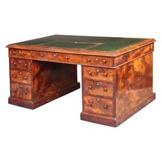 an old wooden desk with green leather top and drawers on one side, isolated against a white background