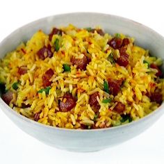 a white bowl filled with rice and vegetables