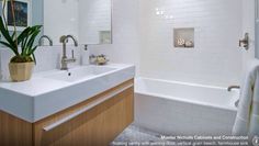 a bathroom with two sinks and a bathtub