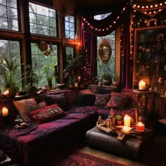 a living room filled with lots of furniture and candles