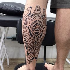 a man with a tattoo on his leg