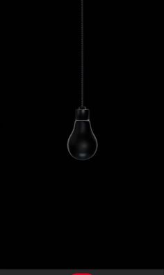 an image of a black light bulb hanging from the ceiling in front of a dark background