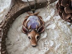 » One-of-a-kind deer pendant with an amethyst crystal 𝗦𝗜𝗭𝗘 Pendant: 3.5" inches Necklace Length: 10"  inches 𝗦𝗛𝗜𝗣𝗣𝗜𝗡𝗚 Necklace will come in bubble wrap, and be packaged in an upcyclable fabric bag. Small Packet™ does not come with tracking. If you would like a tracked package, select from one of the other available options. ---- Thanks for stopping by! If you have any questions, feel free to contact me through my main shop page. ★ Please read my Shop Policies and FAQ for additional i Deer Totem, Gifts For Witches, Deer Pendant, Totem Necklace, Witchy Necklace, Goth Cottagecore, Deer Jewelry, Deer Necklace, Cottagecore Gifts