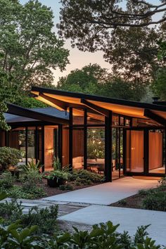 a modern house in the middle of some trees