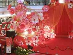 a red carpet with flowers and lights on it