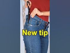 a woman in jeans is holding her purse and has the words new tip written on it