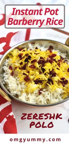 a bowl filled with rice and other food on top of a red and white table cloth