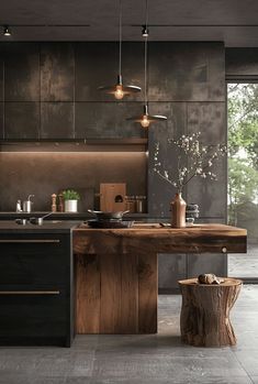 a modern kitchen with black cabinets and wood accents