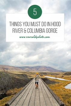 a person walking down a wooden bridge with the words 5 things you must do in hood river and columbia gorge