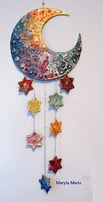 the moon and stars are hanging on the wall