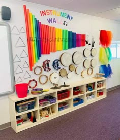 the wall is decorated with musical instruments and rainbows on it's wallshelves