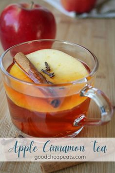 glass mug of apple cinnamon tea on wood surface with apple nearby. Easy Party Food