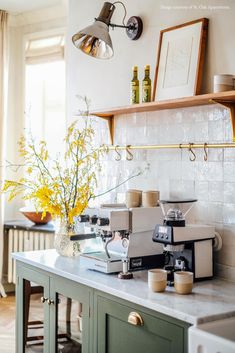 a coffee machine sitting on top of a kitchen counter