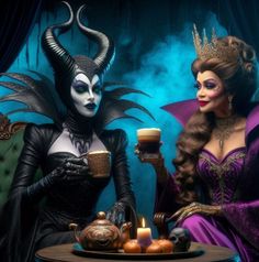 two women dressed as maleficent, one holding a drink and the other wearing a costume