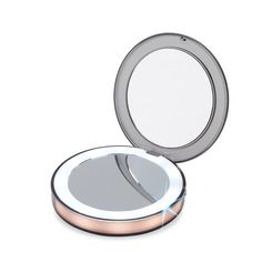 an empty compact mirror on a white background