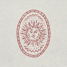 a drawing of a sun in the middle of a circle with red lines on it