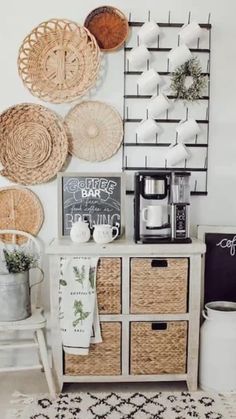 a white room with baskets on the wall and a rug in front of it,