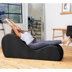 a woman is sitting on a bean bag chair