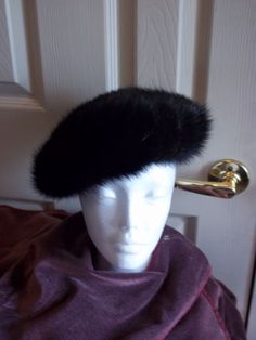 Ladies Vintage Genuine Mink Pillbox Hat  This beautiful, luxurious fur beret styled hat is truly elegant. The genuine mink is in tremendous condition, still with all the luster that turned hears half a century ago. In pristine condition, this hat is clean, crisp, and ready to wear right out of the box! Don't miss the chance to make this wonderful hat a part of your collection.  7 1/2" Diameter, 21" circumference  *Decorative Items in Photos NOT included or for sale. ONLY the hat is for sale.  Item ID: 10_327_328   Be sure to check out the rest of our huge vintage neck tie and retro clothing selection here in our Etsy store! Beret Style, Pillbox Hat, Pill Boxes, Berets, Retro Outfits, Hat Fashion, Neck Tie, Caps Hats, Accessories Hats