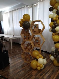 a room filled with balloons and wooden shelves