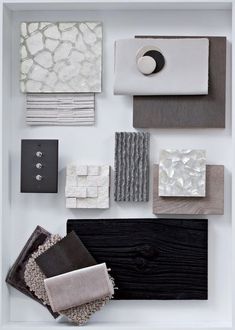 an assortment of different materials are displayed on a white surface with black and gray accents