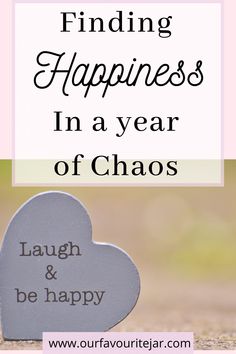 a heart shaped plaque with the words finding happiness in a year of chaos