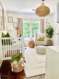 a baby's room is decorated in white and green