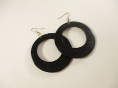 Big black round earrings Big round circles in a light wood painted black Large statement 90's earrings with a 60s vibe The earrings are for pierced ears CONDITION In very good condition.  No wear, or age MEASUREMENTS Earrings 2.5 inches in width Full length including hook is 3.5 inches DESIGNER unknown SHIPPING We combine shipping, so have a look around as you will save money on shipping if you purchase more than one item from us in a single checkout. QUESTIONS / COMMENTS / SPECIAL REQUESTS Plea 90s Earrings, 60s Vibe, Wood Circles, Big Earrings, Round Earrings, Little Gifts, Ear Piercings, Painting On Wood, Beautiful Earrings