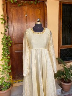 Traditional Anarkali suit usa /cream anarkali hand embroidery dress / pure chanderi handloom dress with embroidery  /Hanloom dresses / voggish /white anarkali  dress / pure silk dress          Looking for a perfect indian dress/anarkali/suit sets that are trendy, unique and easy to carry !! yess, You are at the right place. we carry such versatile pieces of anarkalis and suit sets, kurtas that really let you stand out in any occassion !!      featuring this beautiful pure handloom chanderi anarkali dress in pearl white color with hand embroidery at the neck and sleeves as shown !! A very classy, beautiful yet traditional , perfect and super comfy for any occasion !! Ready to ship , Can be customized in colors and patterns !! this set comes with chudi pants as shown in the picture!! Details Long Sleeve Chanderi Anarkali Set With Dori Work, Long Sleeve Raw Silk Kurta With Gota Work, Off White Raw Silk Anarkali Dress, Off White Anarkali Dress In Raw Silk, Designer Long Sleeve Anarkali Set With Resham Embroidery, Anarkali Long Sleeve Kurta With Gota Work, Anarkali Kurta With Gota Work And Long Sleeves, Designer Anarkali Gown In Cream, Off White Dress With Gota Work For Eid