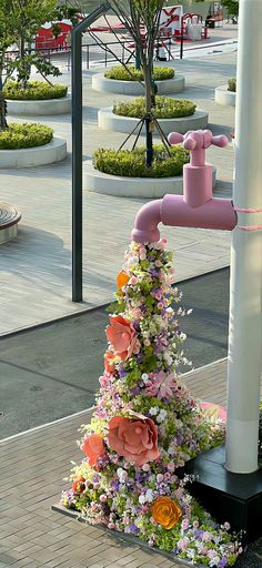 a tree made out of flowers and pipes