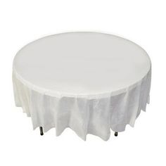 a round table with white cloth on it