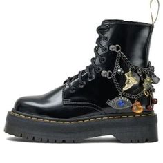 A Fearless Evolution Of Our 8-Eye Silhouette, The Jadon Marc Jacobs Is Built With Vegan-Friendly Materials And Has Signature Docs Touches, Including Yellow Welt Stitching And The Airwair Heel Loop. Silver Chains Adorned With Charms Are Wound Around The Boot And Pay Homage To Marc Jacob’s Own Collection. The Boot Is Finished With A Dual-Branded Tongue And Swing Tag. Kemble Pu Is A Vegan-Friendly Material With A Smooth Matte Finish Goodyear-Welted Lines Are Heat-Sealed And Reinforced With Our Sign Led Zeppelin Shoes, Bejeweled Combat Boots, Jenny Fairy Boots, Jadon Boots Outfit, Dr Martin Boots, Boot Charms, Jadon Boots, Eye Silhouette, Marc Jacobs Shoes