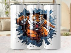 two mugs with an image of a tiger on them