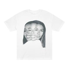 a white t - shirt with an image of two women's faces on it