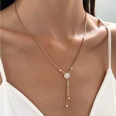 Gold Plated 24” Crystal Ball Lariat Necklace. A Beautiful Delicate Piece Brand New Gold Rhinestone Round Pendant Necklace, Elegant Metal Charm Necklace With Lariat Shape, Elegant Metal Charm Necklace Lariat, Elegant Metal Lariat Charm Necklace, Adjustable Chain Necklace With Round Pendant, Adjustable Dangle Rhinestone Necklace For Gift, Adjustable Rhinestone Dangle Necklace As A Gift, Adjustable Trendy Rhinestone Necklace, Trendy Adjustable Rhinestone Necklace