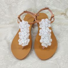 Beach wedding sandals - Greek leather - White flower lace decorated sandals -Bridal party shoes- White flats- Bridal party shoes -Beach wedding       This pair is made of genuine Greek leather and is decorated with three lace flowers with pearls. Elegant leather sandals, a must have accessory for the summer. It's a great gift for a bride or your bridesmaids. They could be perfect for any woman who wants to make a difference & wear something special every day. *All sandals are made of Genuine Gre Elegant Lace Wedding Shoes For Summer, Elegant Summer Wedding Shoes With Lace, Elegant Summer Wedding Shoes In Lace, Elegant Sandals For Bridal Shower In Spring, Spring Wedding Lace Shoes, Spring Lace Wedding Shoes With Ankle Strap, Elegant Summer Sandals For Bridal Shower, Spring Wedding Shoes With Lace And Ankle Strap, Spring Wedding Shoes With Ankle Strap In Lace